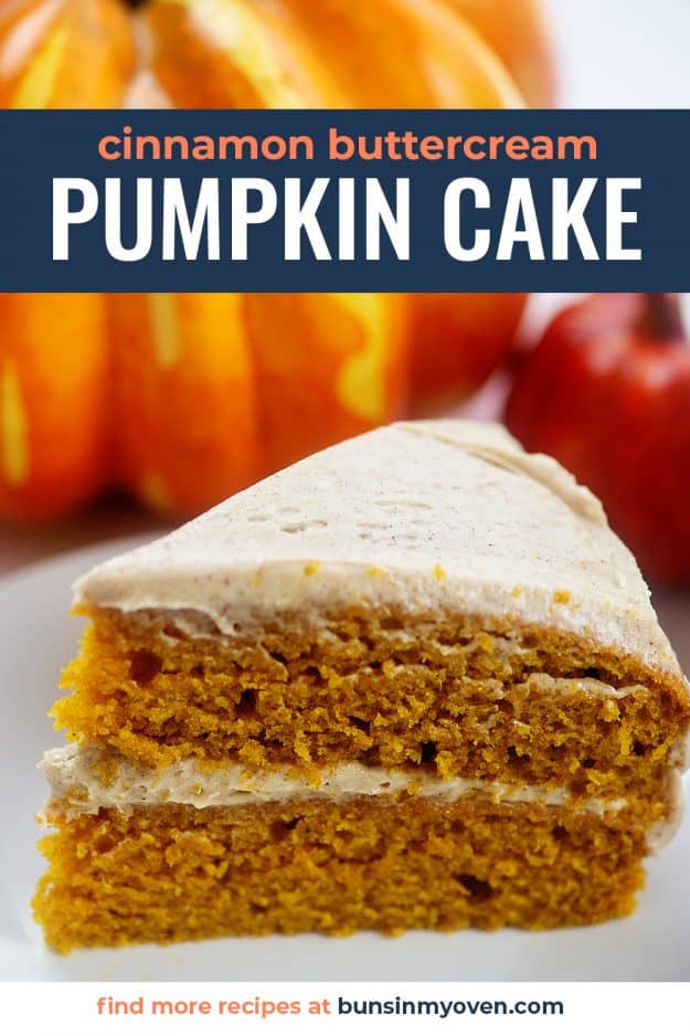 slice of pumpkin cake on white plate with pumpkins in the background.