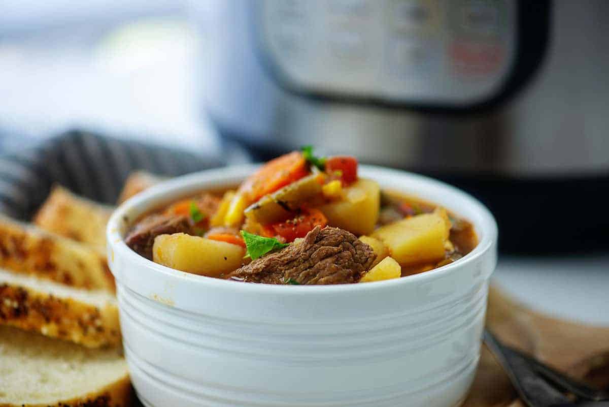 white bowl filled with vegetable beef soup recipe.