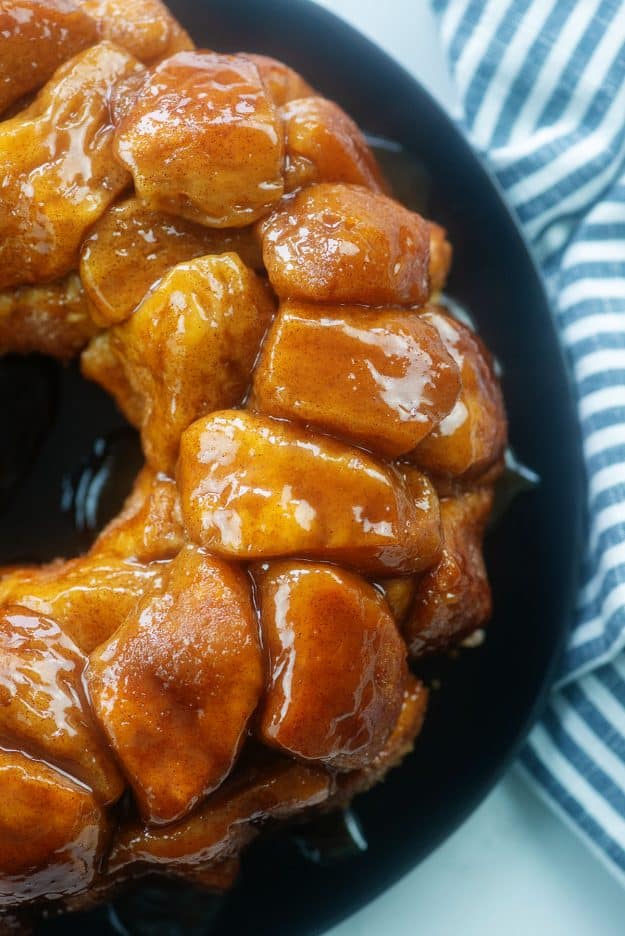 monkey bread on black plate.