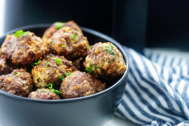 black bowl full of Italian meatballs.