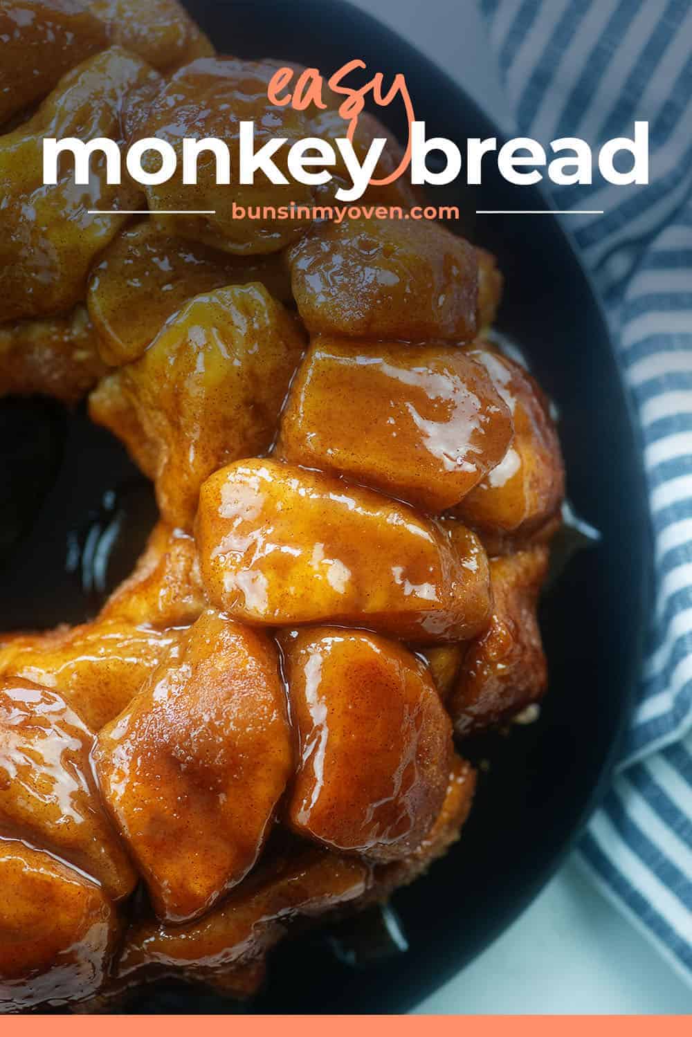 caramel monkey bread on black plate.