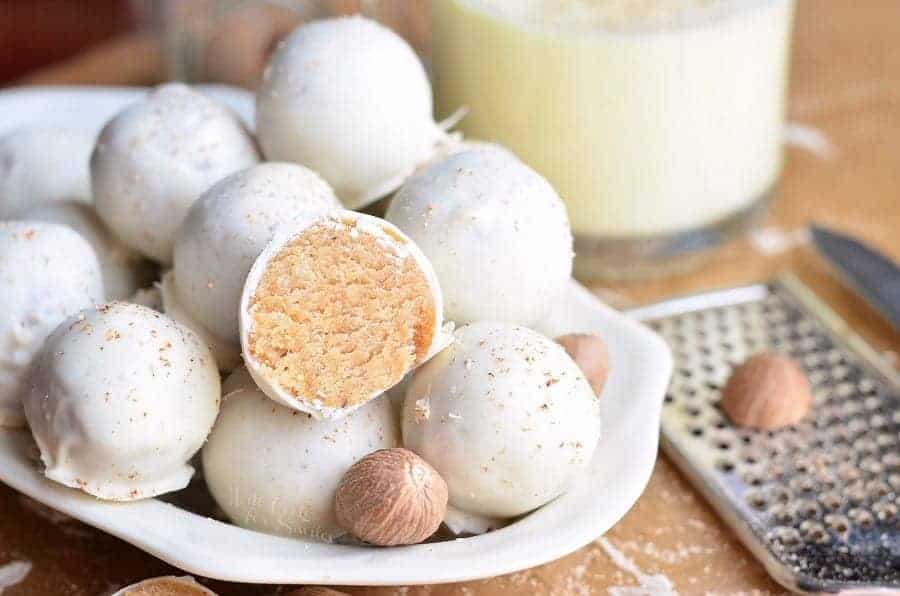 eggnog cookie balls on white plate.