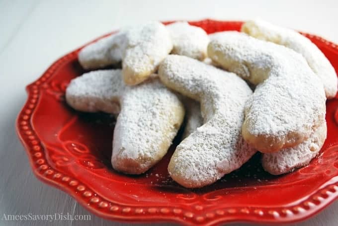 crescent cookies on red plate.