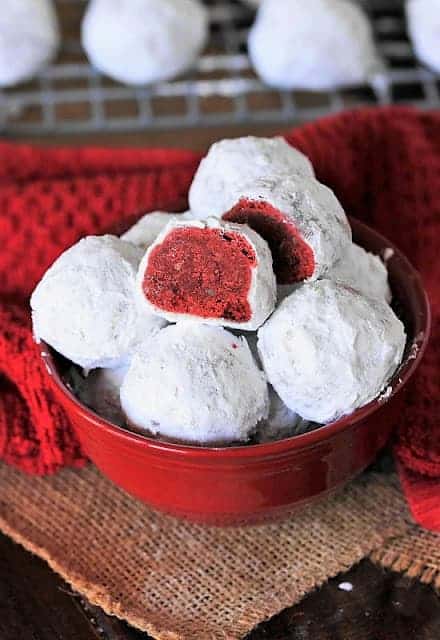 snowball cookies in red bowl.