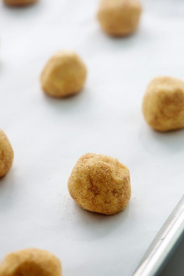 cookie balls on baking sheet.