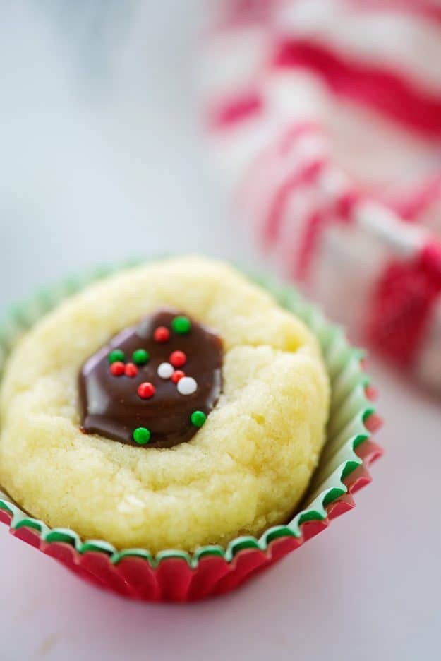 thumbprint cookie in Christmas paper.