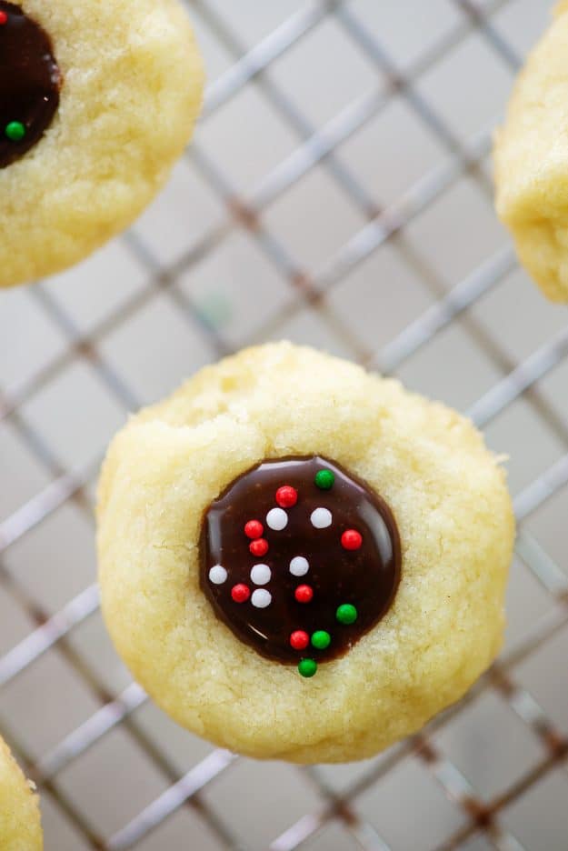 chocolate thumbprint cookie topped with Christmas sprinkles.