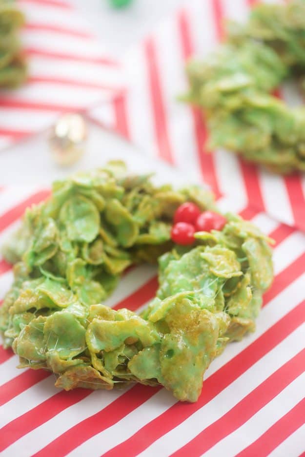 no bake wreath cookies on red and white paper.