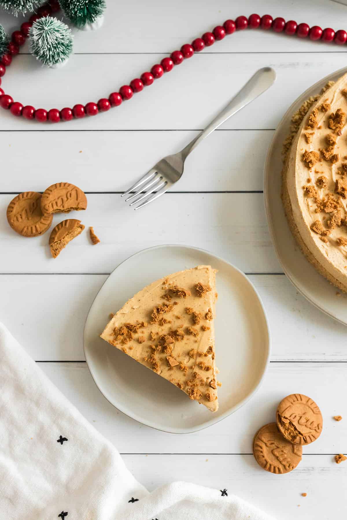 no bake gingerbread cheesecake on white wooden table.