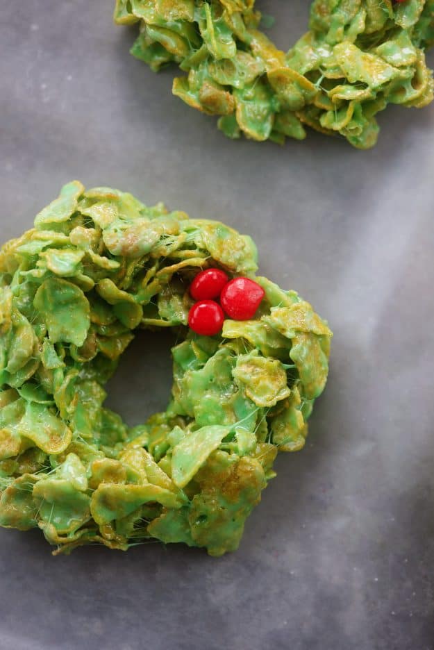 cornflake wreath cookies on parchment paper.