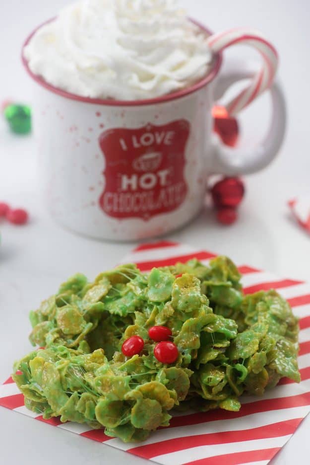 pile of cornflake wreaths on red and white striped paper.