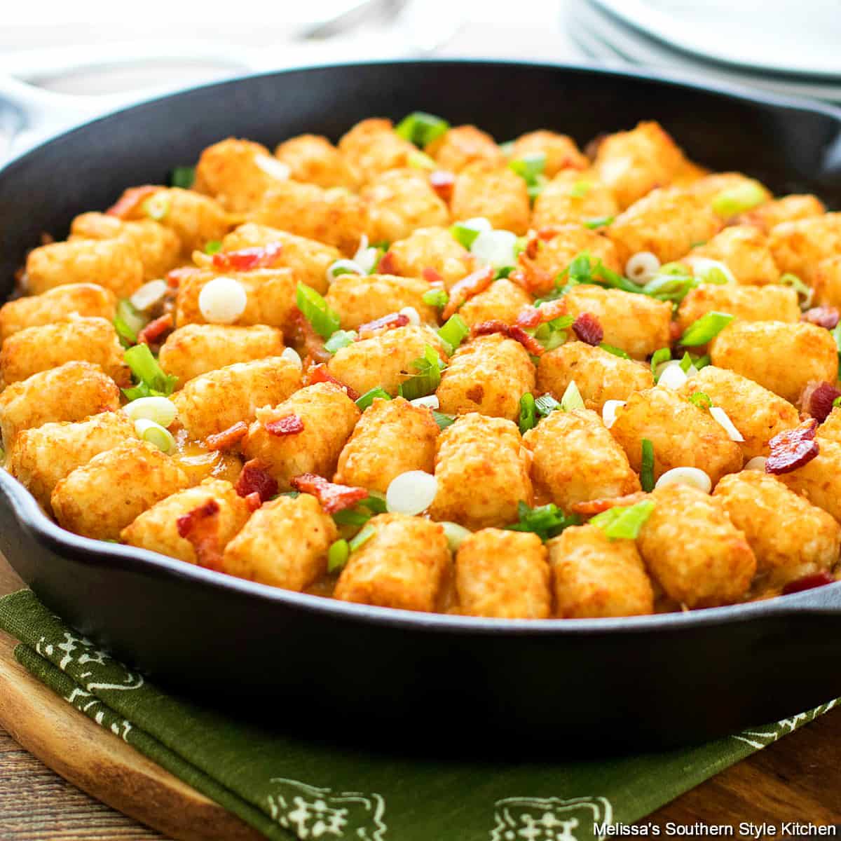 bacon cheeseburger tater tot casserole in cast iron skillet.