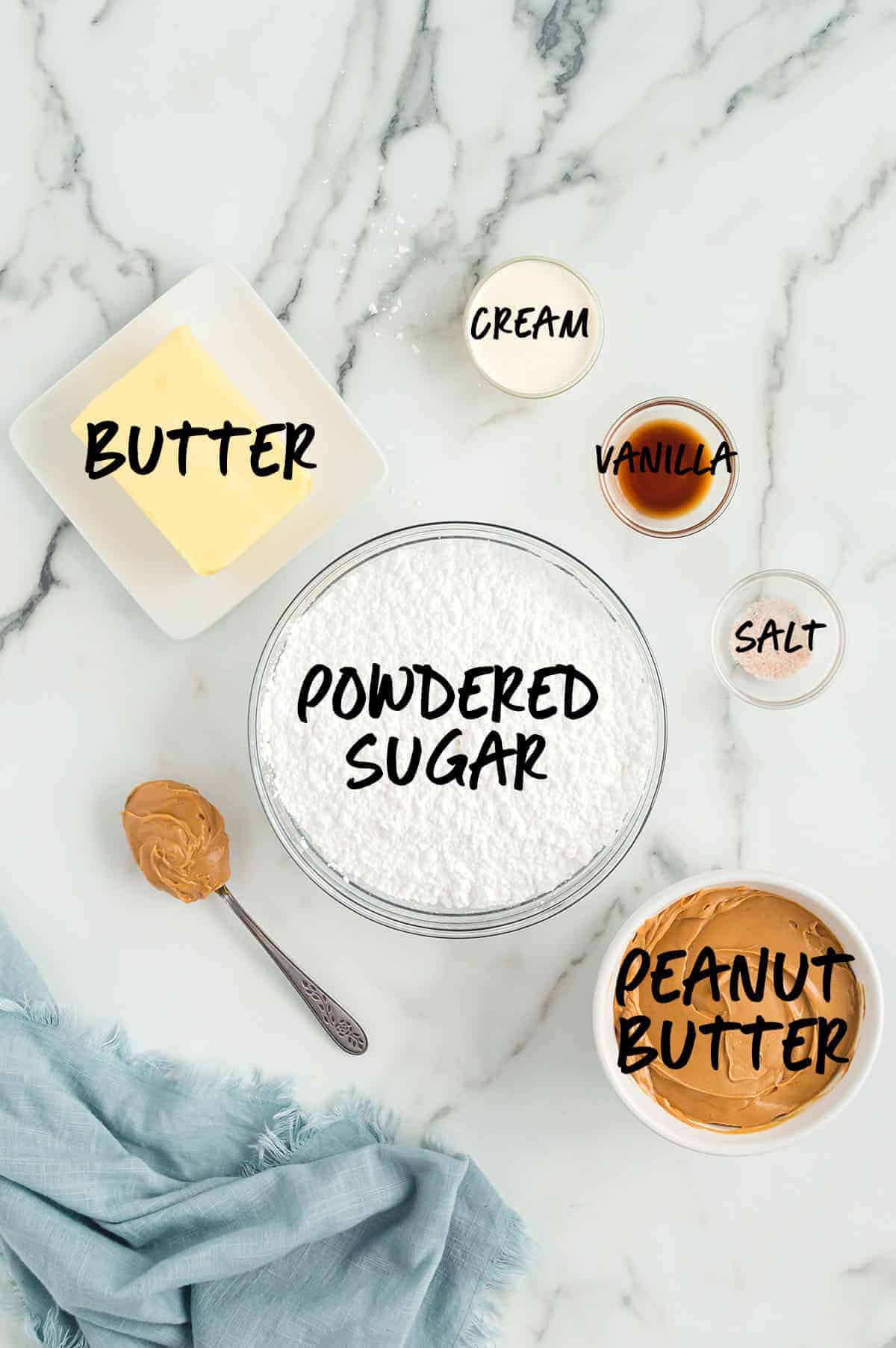 ingredients for easy peanut butter fudge in bowls on white countertop.