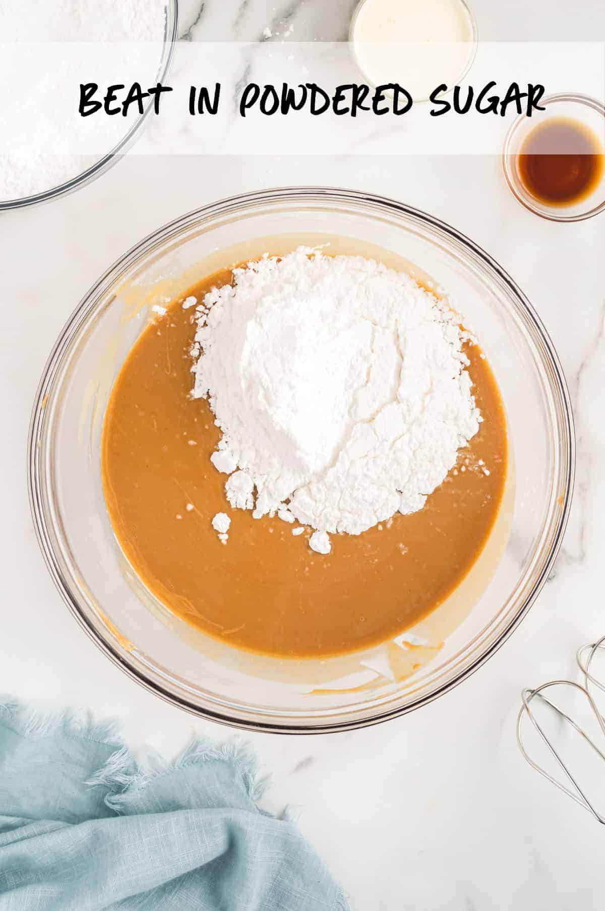 powdered sugar in mixing  bowl with melted peanut butter.