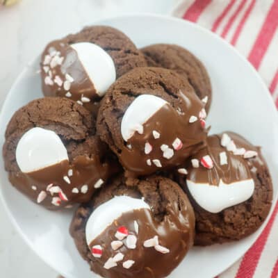 overhead view of peppermint chocolate cookies on white plate.
