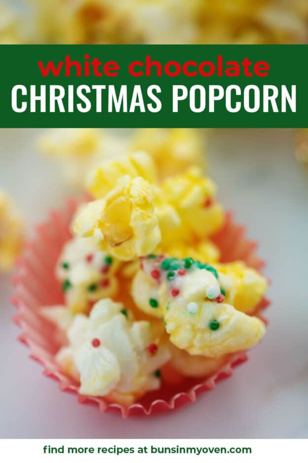 White chocolate Christmas popcorn in small red dish.