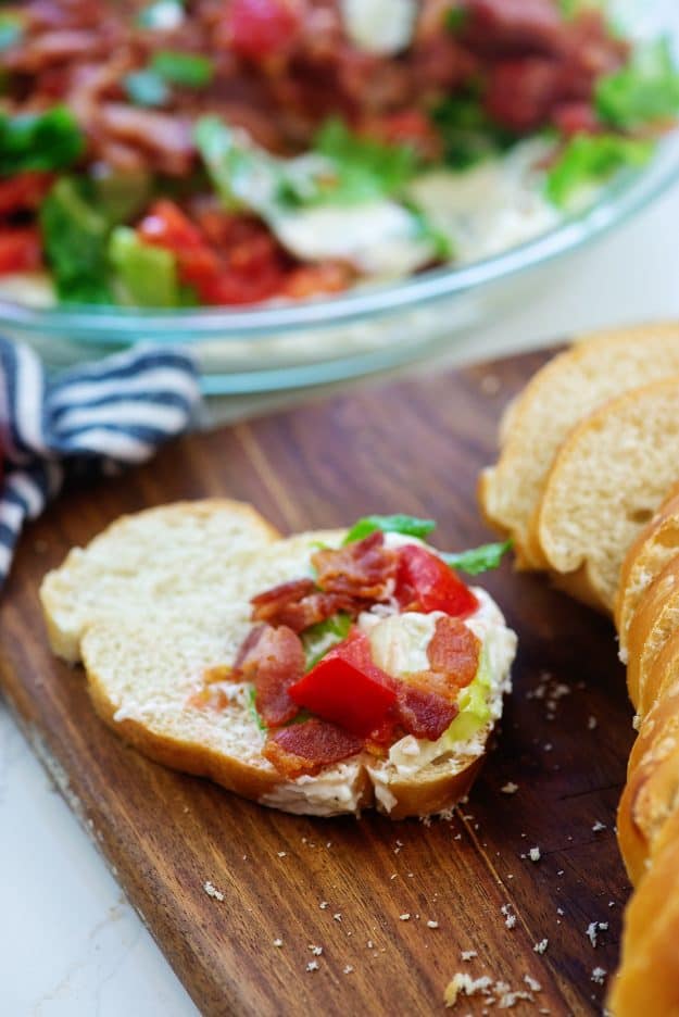 BLT dip on piece of bread.