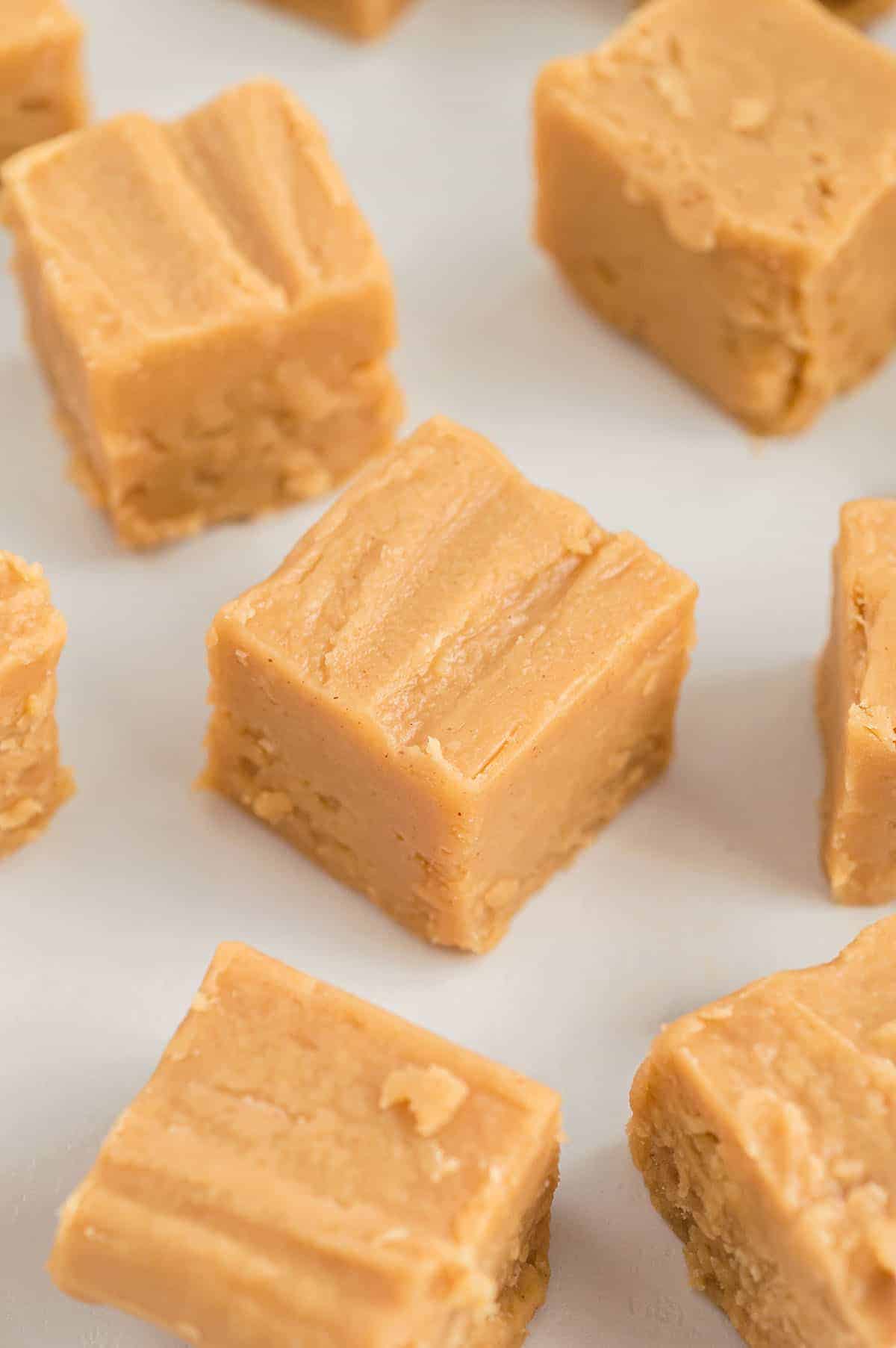 smooth and creamy peanut butter fudge on white countertop.