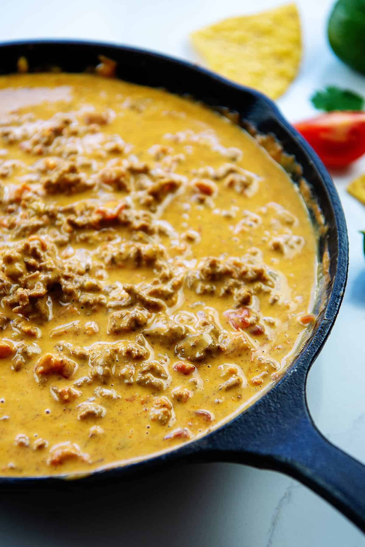 Rotel cheese dip in cast iron skillet.