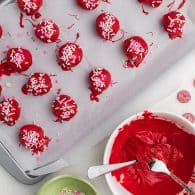 decorated cookie truffles on baking sheet.