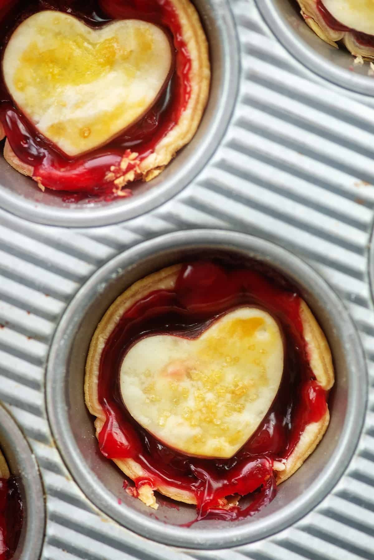 mini cherry pie in muffin tin.