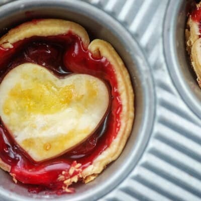 overhead view of mini cherry pies in muffin tin.