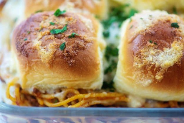 baked spaghetti sandwiches in glass dish.