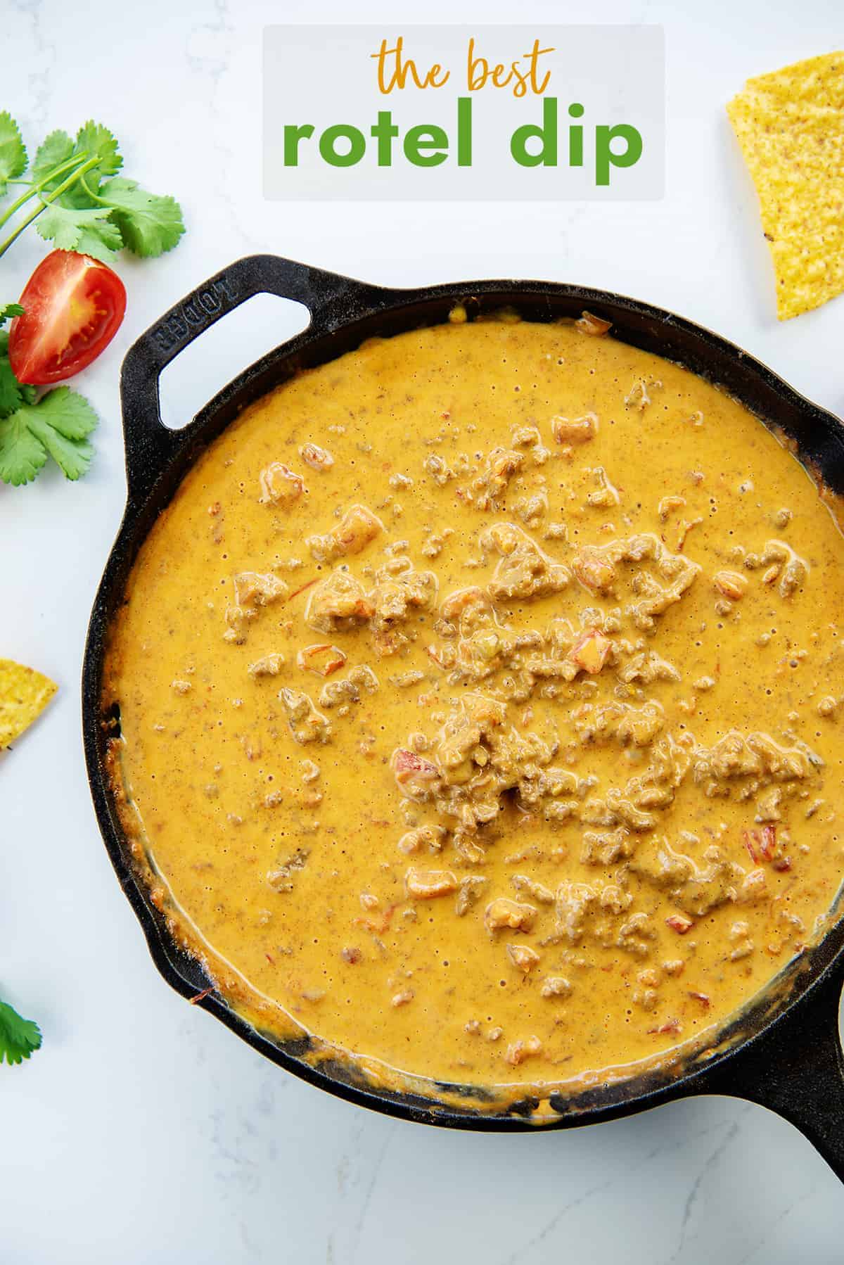 overhead view of rotel dip with ground beef in cast iron skillet.