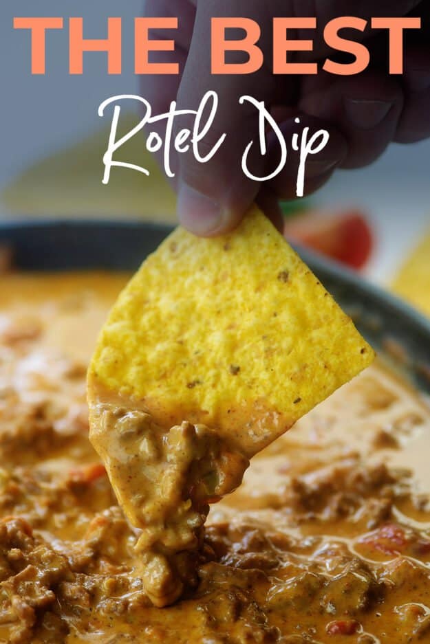 chip being dipped into rotel cheese dip.