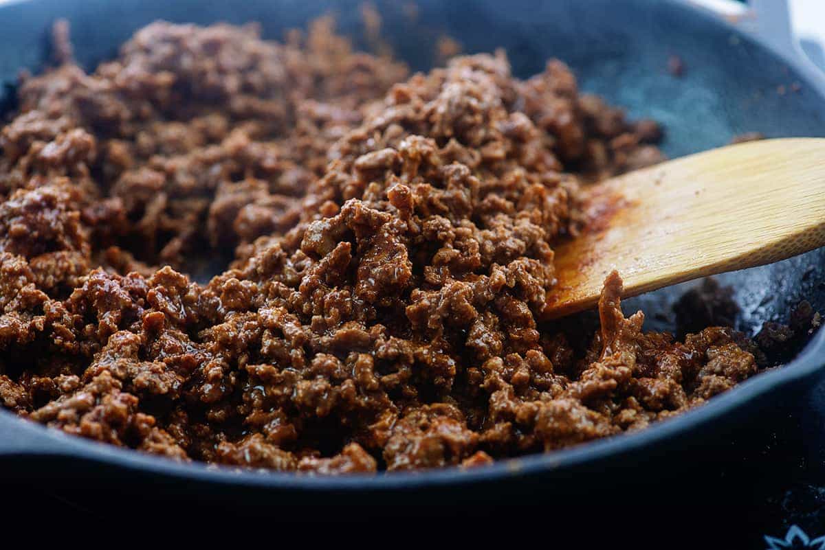 seasoned ground beef in cast iron skillet.