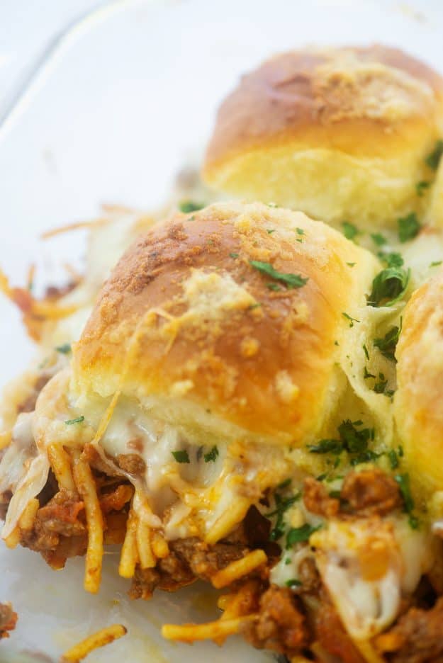 cheesy spaghetti sandwiches in glass baking dish.