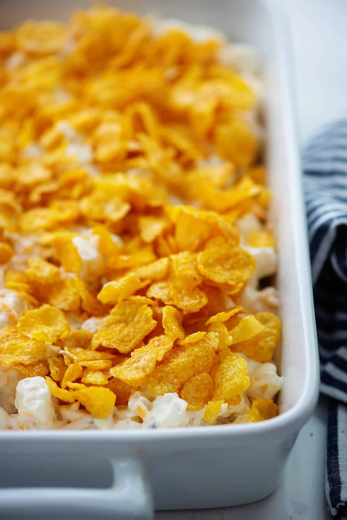 funeral potatoes recipe topped with cornflakes.