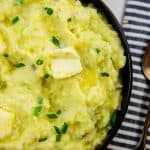 colcannon in bowl with butter on top.