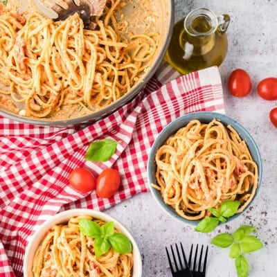 overhead view of creamy feta pasta in bowls.