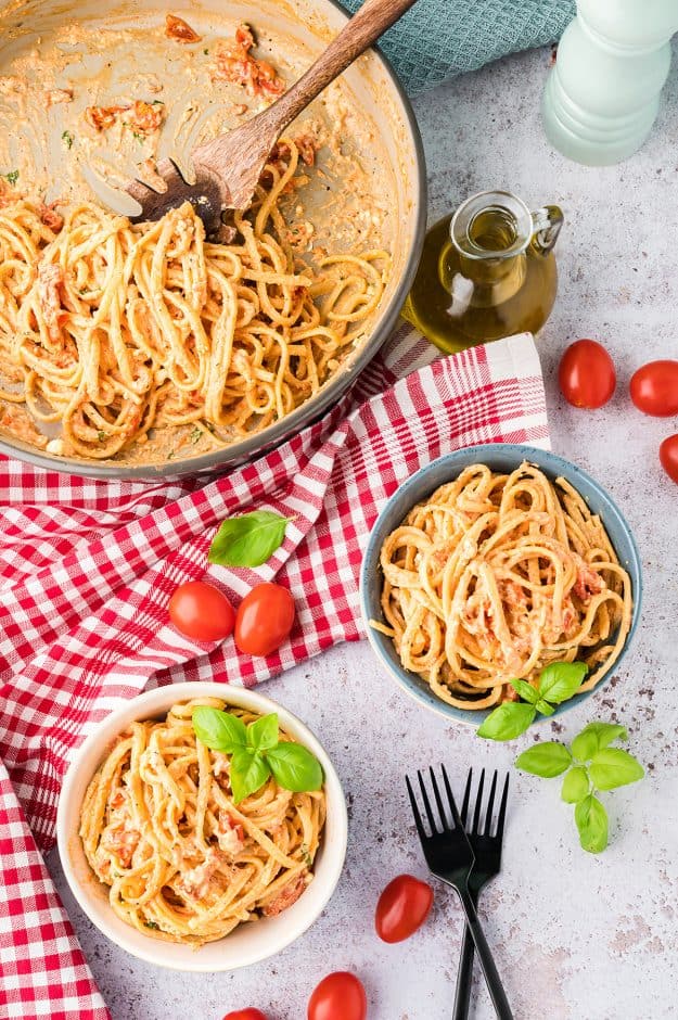 overhead view of creamy feta pasta in bowls.