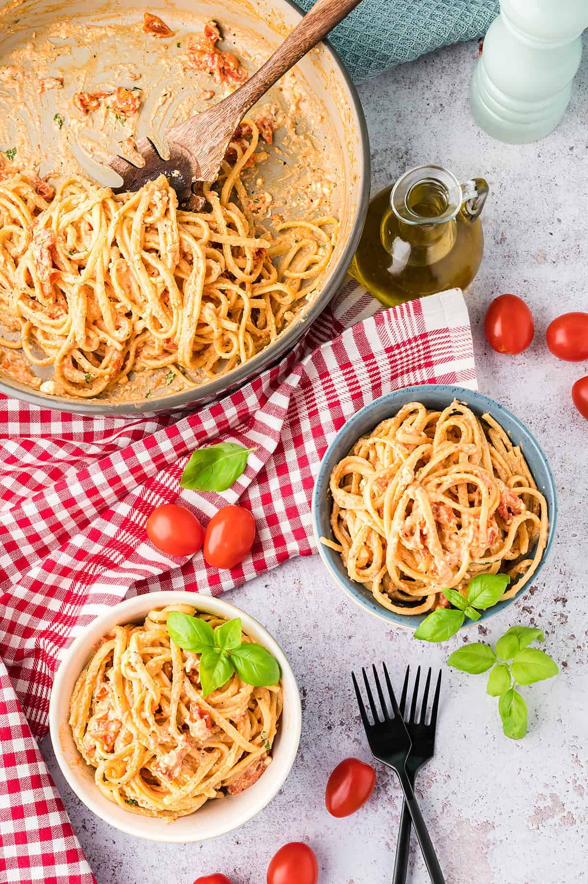 overhead view of creamy feta pasta in bowls.