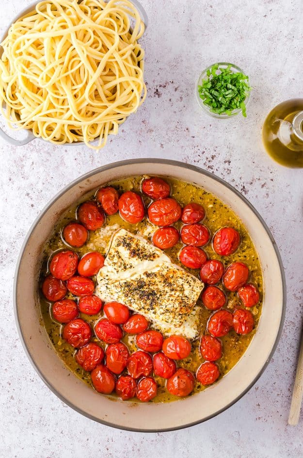 roasted tomatoes and feta in baking dish.