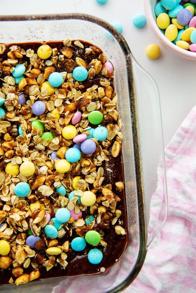 oatmeal and candy topped brownies in glass baking dish.