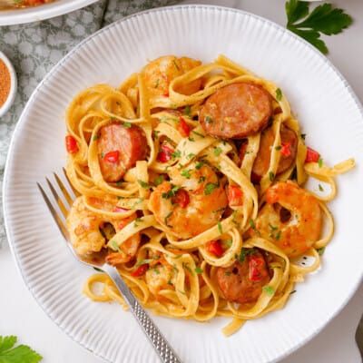 white plate loaded with cajun shrimp pasta recipe.