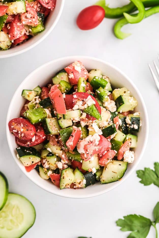 healthy vegetable salad recipe in white bowls.