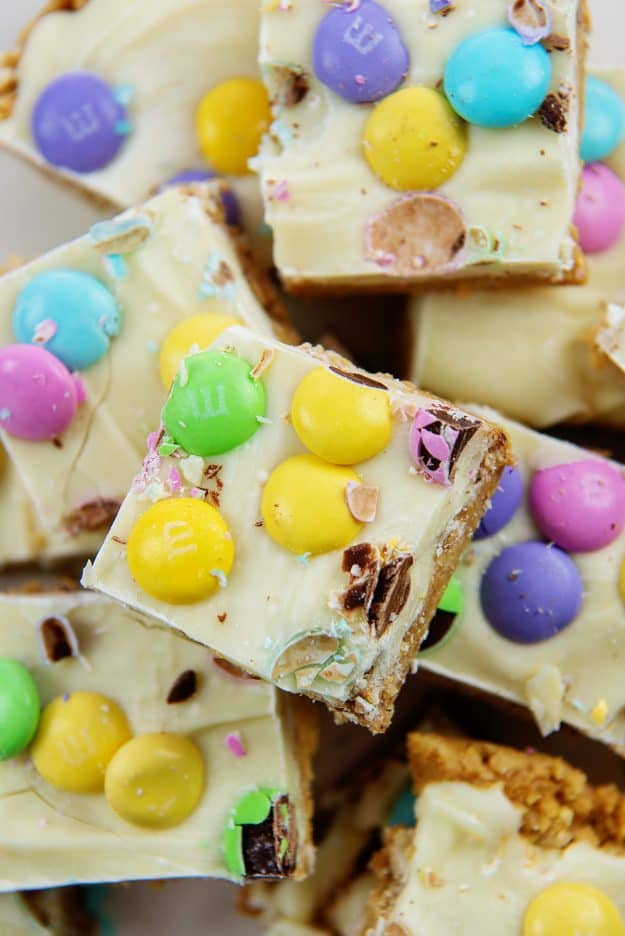 Pile of Easter no bake peanut butter bars.