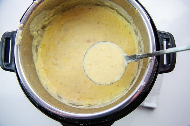 potato soup in Instant Pot on ladle.