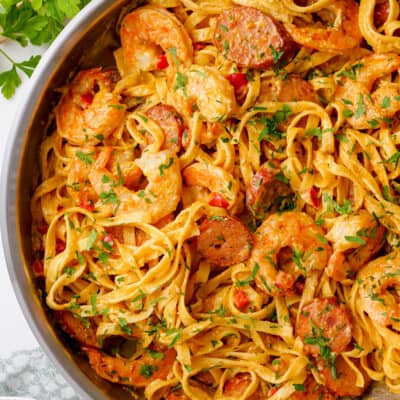 overhead view of cajun shrimp pasta in skillet.