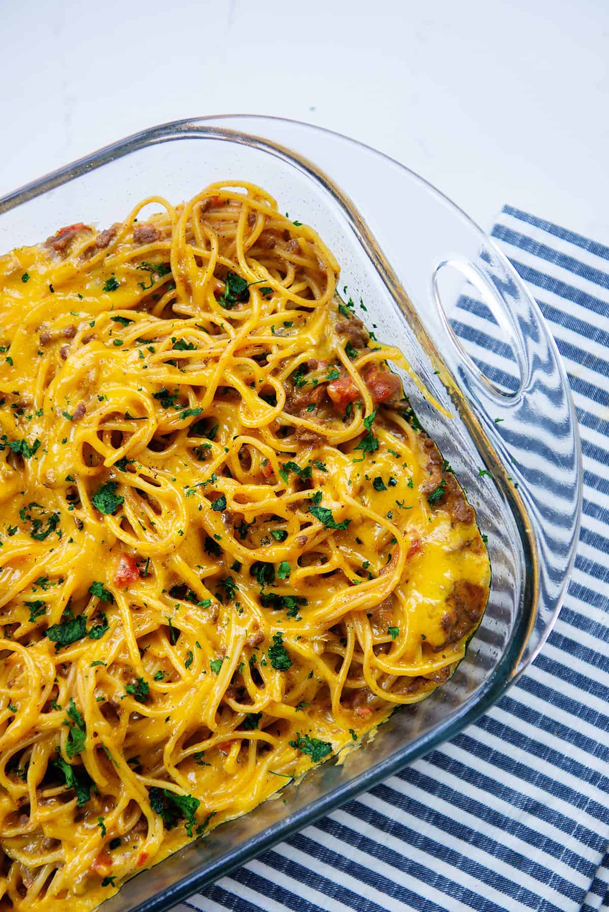 taco spaghetti bake in glass baking dish.