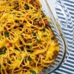 Cheesy taco spaghetti in casserole dish.