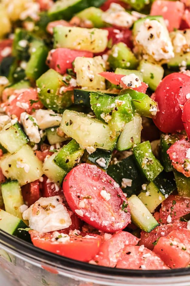 close up of healthy salad vegetables in glass bowl.