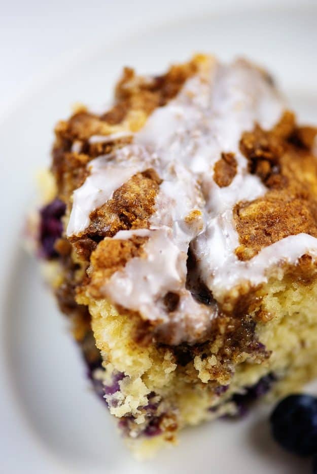 cinnamon blueberry breakfast cake on white plate.