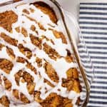 overhead view of blueberry cinnamon roll cake in glass baking dish.