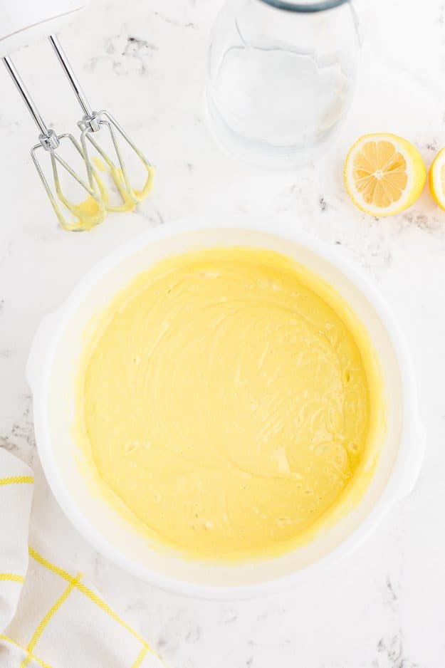 lemon cake batter in white mixing bowl.