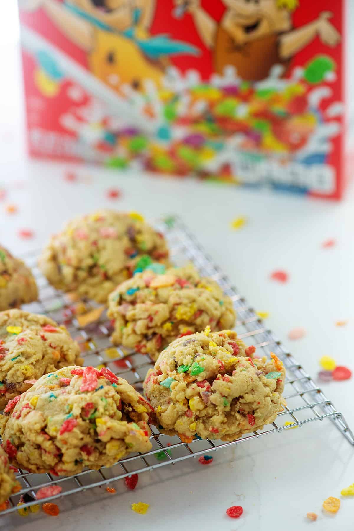 fruity pebbles cookies on cooling rack.